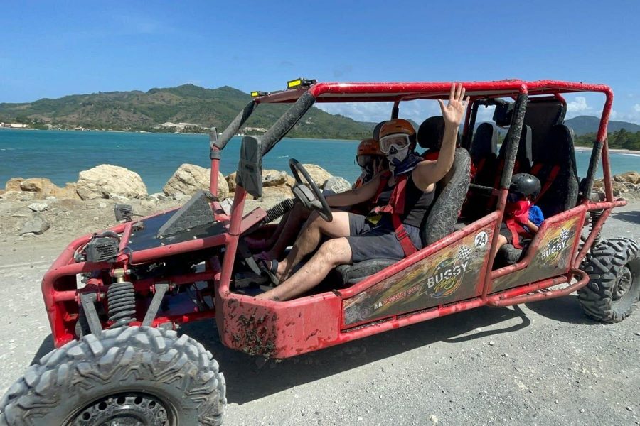 Guests riding a buggy along the coast